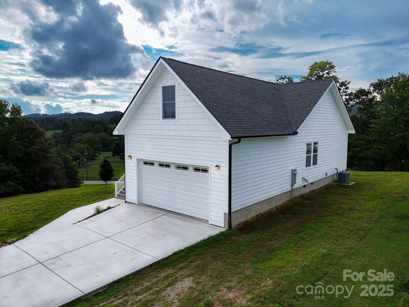 Front exterior of a new home in , Hendersonville, NC, highlighting curb appeal (Image 26). Front exterior of a new home in , Hendersonville, NC, highlighting curb appeal (Image 26).