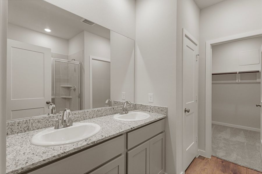 A bathroom with a large mirror. A bathroom with a large mirror.