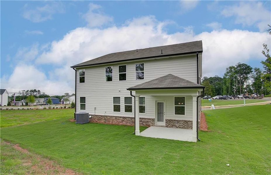 Exterior details and patio area of a home in Kingsmere Estates, Loganville (Image 26).