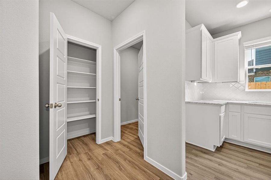 Furnished interior view inside a new home in Sunterra, Katy (Image 15).