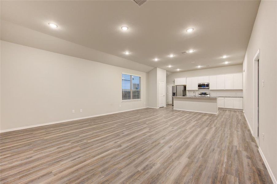 WIDE OPEN CONCEPT- view from your vaulted living room into your kitchen & dining.