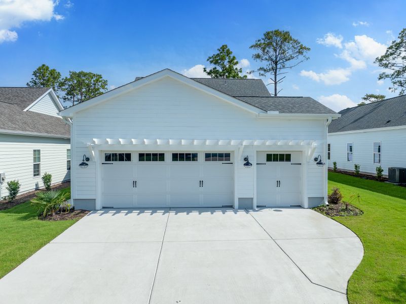 Front exterior of a new home in Osprey Landing, Southport, NC, highlighting curb appeal (Image 31).