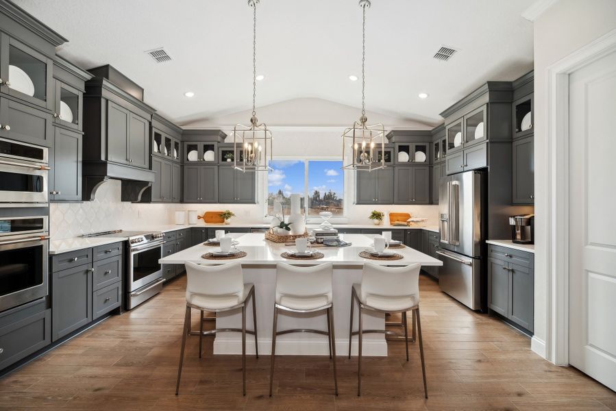 Kitchen with pendant lighting and vaulted ceiling