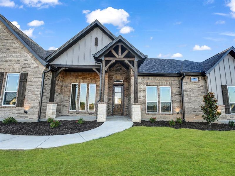 View of front of house with a front yard