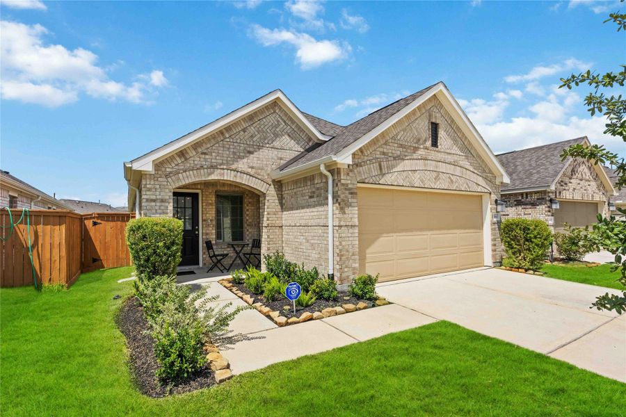 Front exterior of a new home in Marvida, Cypress, TX, highlighting curb appeal (Image 18). Front exterior of a new home in Marvida, Cypress, TX, highlighting curb appeal (Image 18).