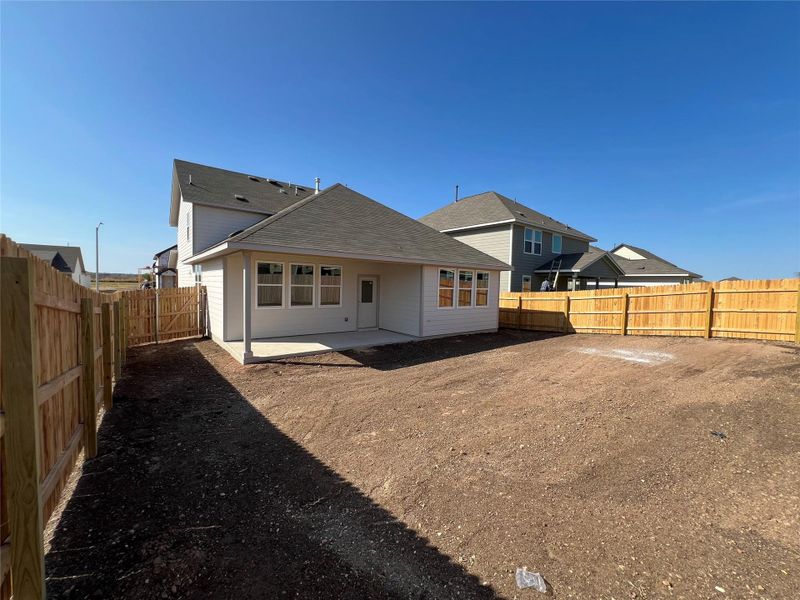 Exterior details and patio area of a home in Rolling Glen, Hutto (Image 12).