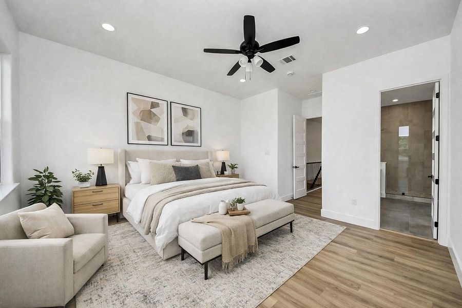 Spacious primary bedroom filled with natural light, featuring a clean, modern design and neutral tones. Generous layout offers comfort and flexibility, perfect for creating a relaxing retreat.