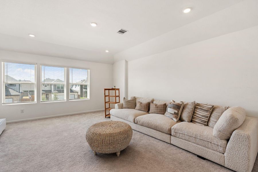 High ceilings and large windows in the game room make this an inviting place to hang out with friends.