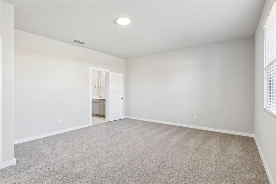 Primary Suite in the Haylee home plan by Trophy Signature Homes - REPRESENTATIVE PHOTO