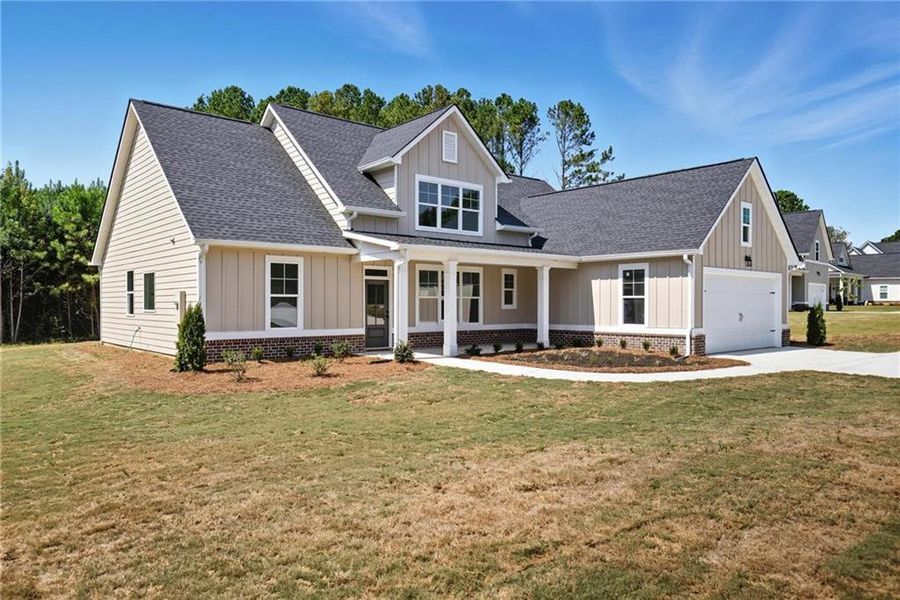 Front exterior of a new home in , Hiram, GA, highlighting curb appeal (Image 1).