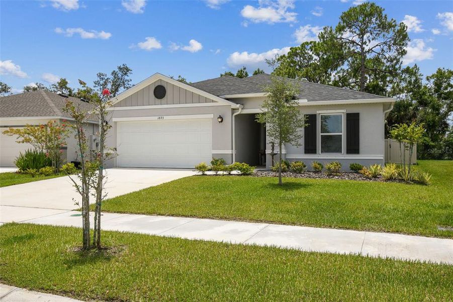 Front exterior of a new home in , Titusville, FL, highlighting curb appeal (Image 27).