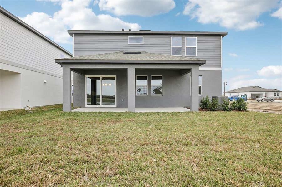 Exterior details and patio area of a home in Oakfield Trails, Parrish (Image 17).