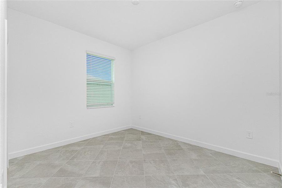 Spacious, unfurnished interior of a new home in Island Lakes at Coco Bay: Villas, Englewood (Image 31).