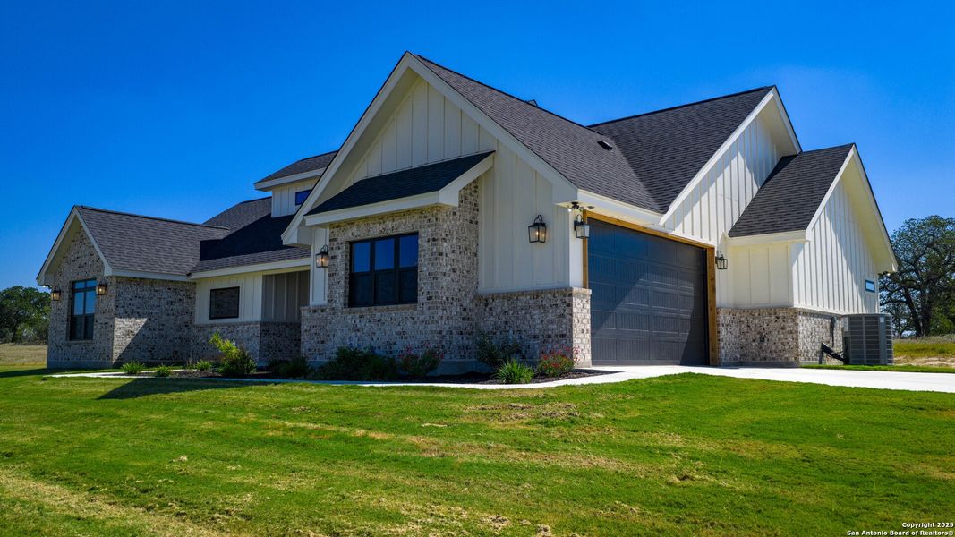 Front exterior of a new home in , Floresville, TX, highlighting curb appeal (Image 27). Front exterior of a new home in , Floresville, TX, highlighting curb appeal (Image 27).