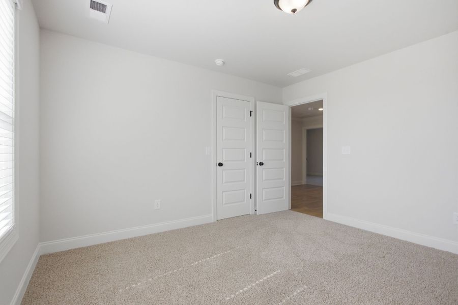 Spacious, unfurnished interior of a new home in Cherokee Knoll, Williamston (Image 28).