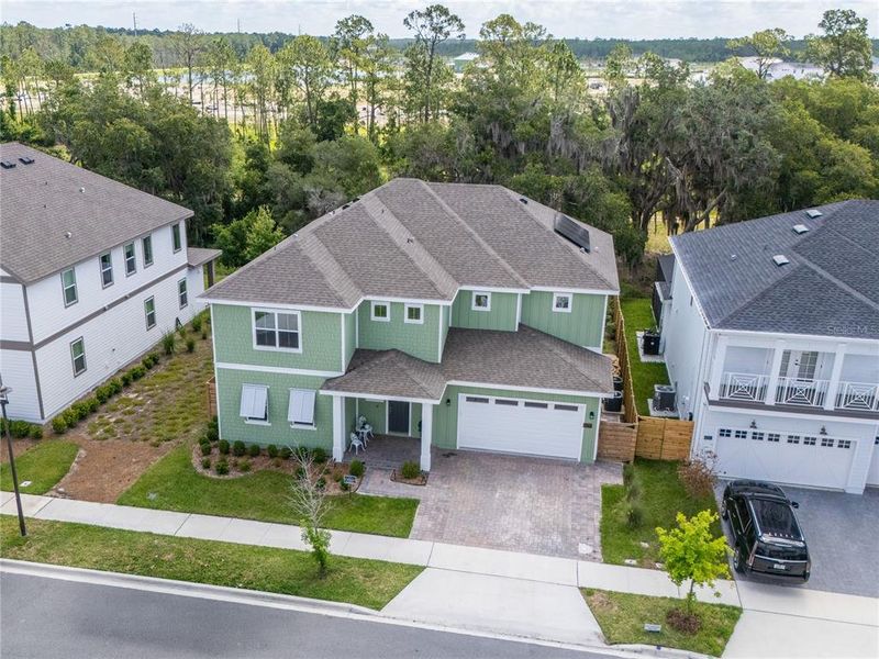 Front exterior of a new home in Weslyn Park at Sunbridge, St. Cloud, FL, highlighting curb appeal (Image 2).