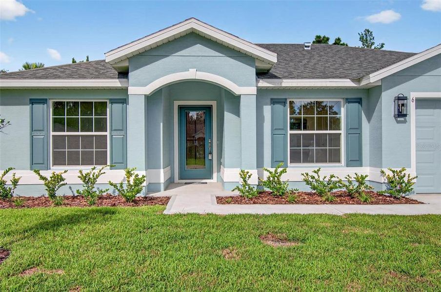 Front exterior of a new home in , Palm Coast, FL, highlighting curb appeal (Image 30).