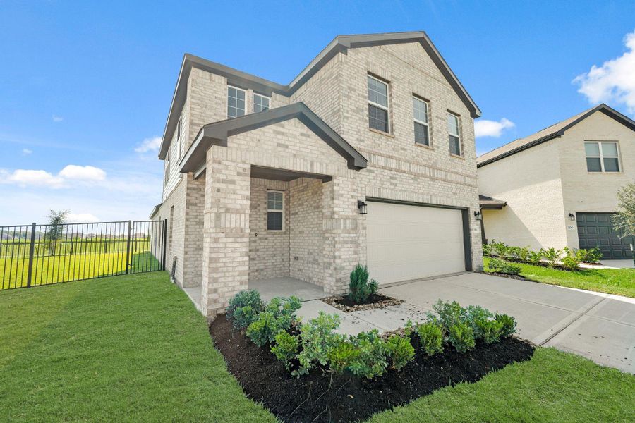 Front exterior of a new home in River Ranch Trails, Dayton, TX, highlighting curb appeal (Image 17). Front exterior of a new home in River Ranch Trails, Dayton, TX, highlighting curb appeal (Image 17).