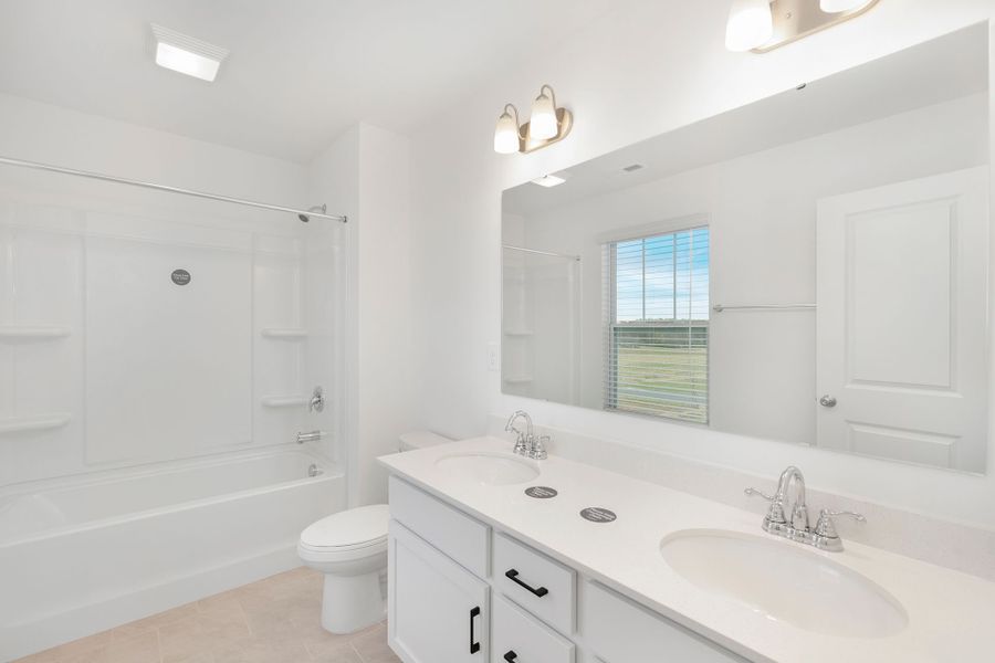 Representative furnished interior of a home built from the TA1800 by True Homes in Streamside, Red Cross (Image 12).