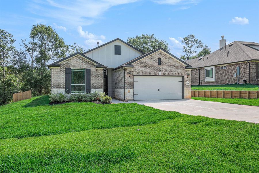 Front exterior of a new home in Oakwood Ranch, Willis, TX, highlighting curb appeal (Image 21).