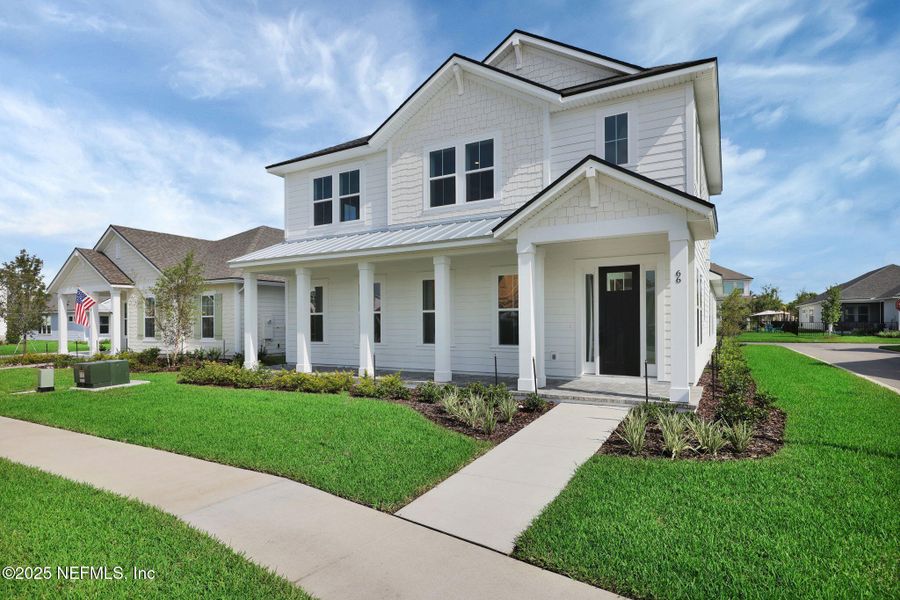 Front exterior of a new home in Seabrook Village at Seabrook, Nocatee, FL, highlighting curb appeal (Image 29). Front exterior of a new home in Seabrook Village at Seabrook, Nocatee, FL, highlighting curb appeal (Image 29).