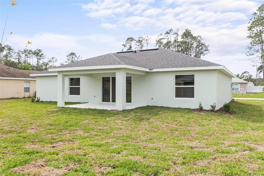Front exterior of a new home in , Palm Coast, FL, highlighting curb appeal (Image 27).