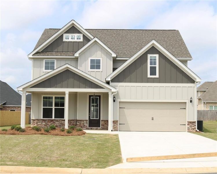 Front exterior of a new home in , Bonaire, GA, highlighting curb appeal (Image 1). Front exterior of a new home in , Bonaire, GA, highlighting curb appeal (Image 1).