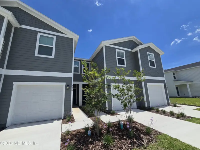 Front exterior of a new home in , Middleburg, FL, highlighting curb appeal (Image 23).