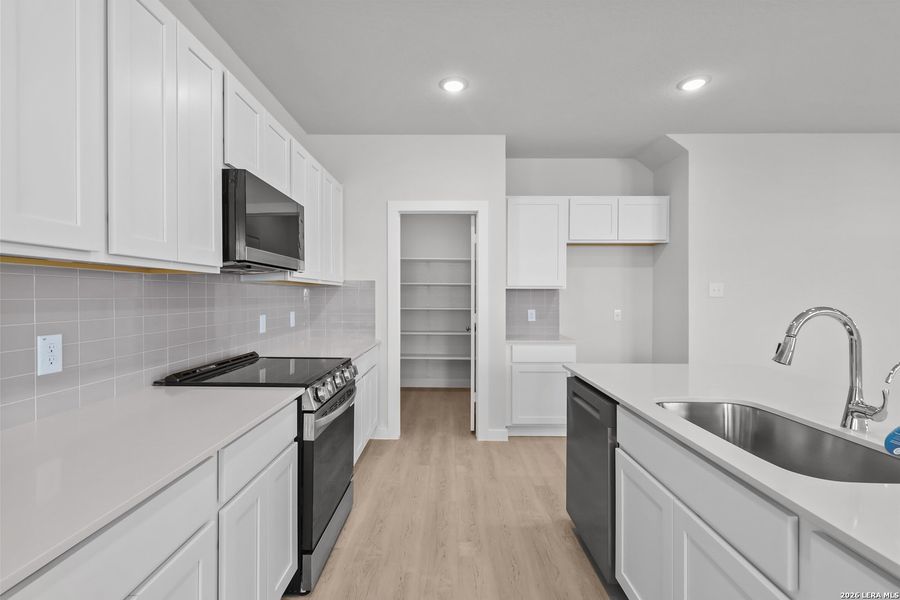 Furnished interior view inside a new home in Millican Grove, San Antonio (Image 6).