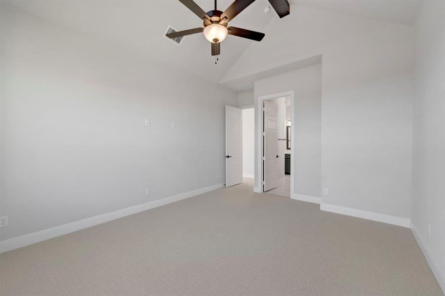Unfurnished bedroom with carpet flooring and ceiling fan Unfurnished bedroom with carpet flooring and ceiling fan