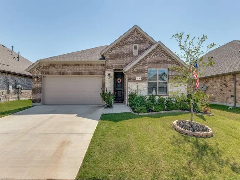 Front exterior of a new home in , Anna, TX, highlighting curb appeal (Image 1). Front exterior of a new home in , Anna, TX, highlighting curb appeal (Image 1).