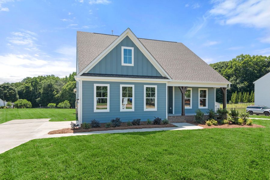 Front exterior of a new home in Redland, Advance, NC, highlighting curb appeal (Image 1). Front exterior of a new home in Redland, Advance, NC, highlighting curb appeal (Image 1).