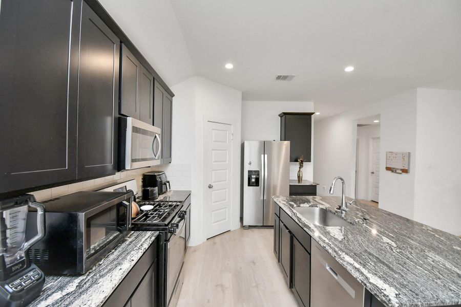 Furnished interior view inside a new home in Post Oak Pointe, Fresno (Image 14).