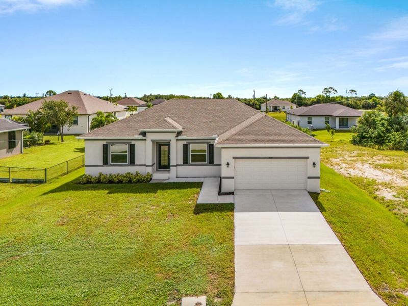 Front exterior of a new home in Cape Coral, Cape Coral, FL, highlighting curb appeal (Image 15).
