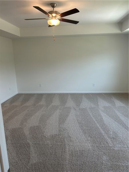 Plush carpeting creates a cozy retreat in this wel