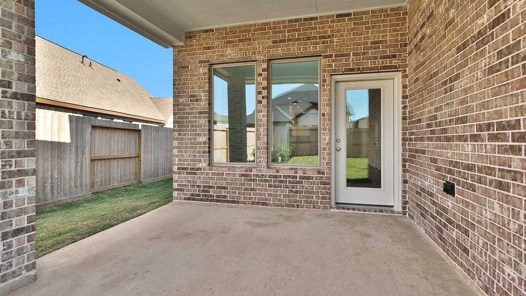 Exterior details and patio area of a home in Candela South 40', Richmond (Image 2). Exterior details and patio area of a home in Candela South 40', Richmond (Image 2).