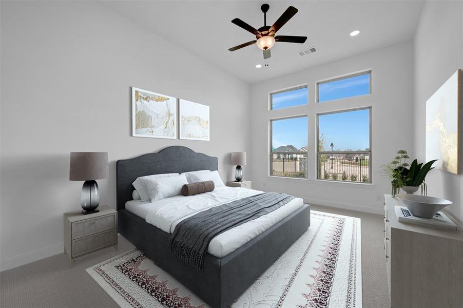 Bedroom featuring light colored carpet, ceiling fan, and recessed lighting