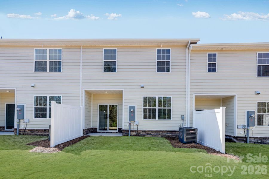 Exterior details and patio area of a home in Cannon Village, York (Image 3).