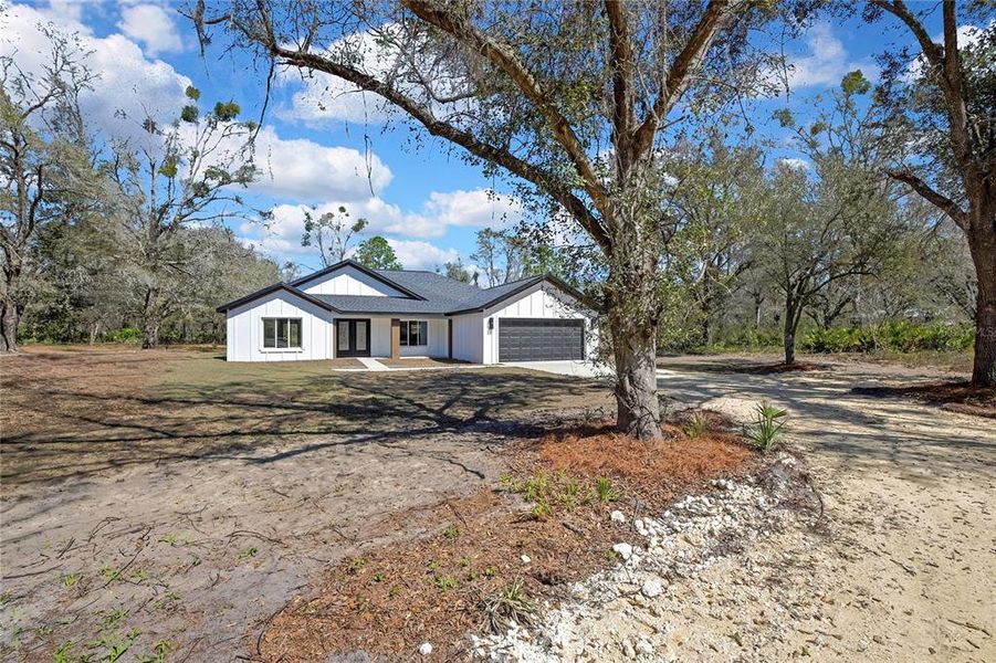 Front exterior of a new home in , Crystal River, FL, highlighting curb appeal (Image 24).