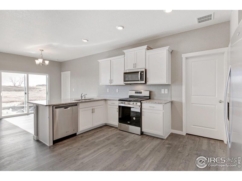 Furnished interior view inside a new home in Silver Peaks, Lochbuie (Image 3).
