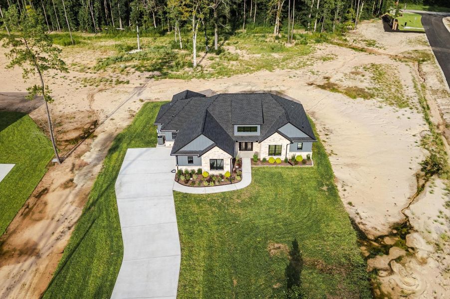 Front exterior of a new home in , Conroe, TX, highlighting curb appeal (Image 25).