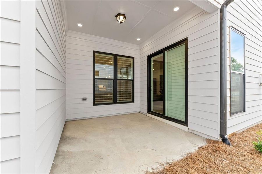Exterior details and patio area of a home in Promenade at Sawnee Village, Cumming (Image 29).
