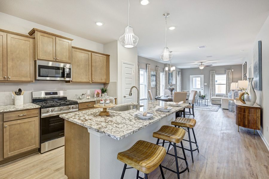 Kitchen into Family Room. Sample image for illustration; upgrades, options, and colors may vary. Kitchen into Family Room. Sample image for illustration; upgrades, options, and colors may vary.