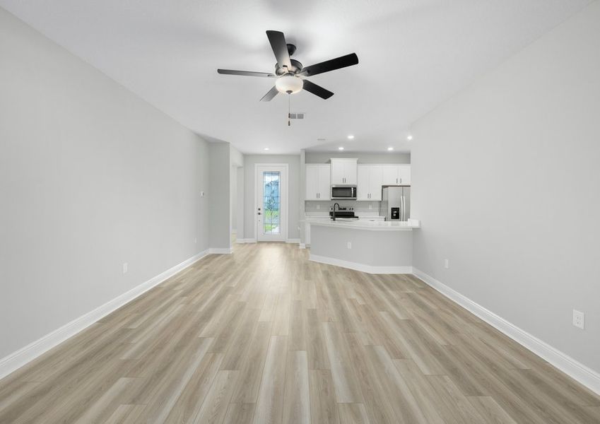 The living room looks over the foyer and kicthen The living room looks over the foyer and kicthen