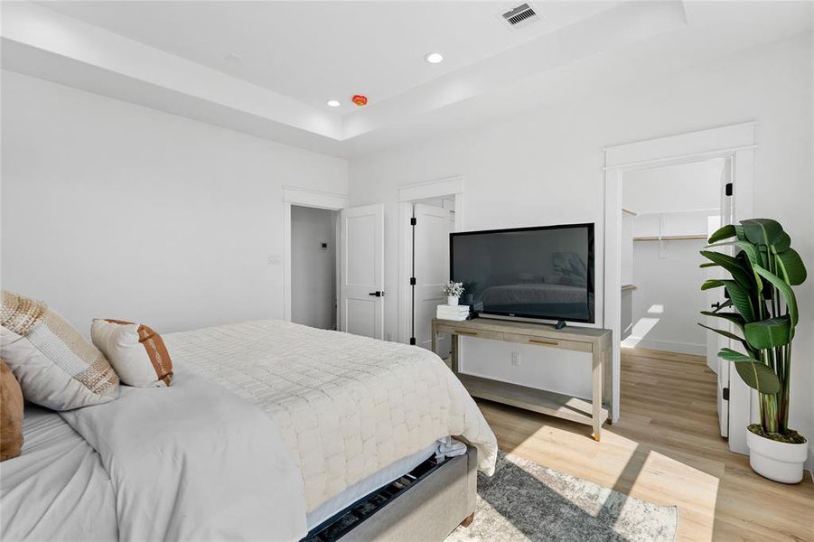 In the primary bedroom, luxury vinyl flooring replaces carpet, while to the right, a spacious walk-in closet awaits, and to the left, your private ensuite offers a sanctuary of relaxation and luxury within the comforts of your own home.