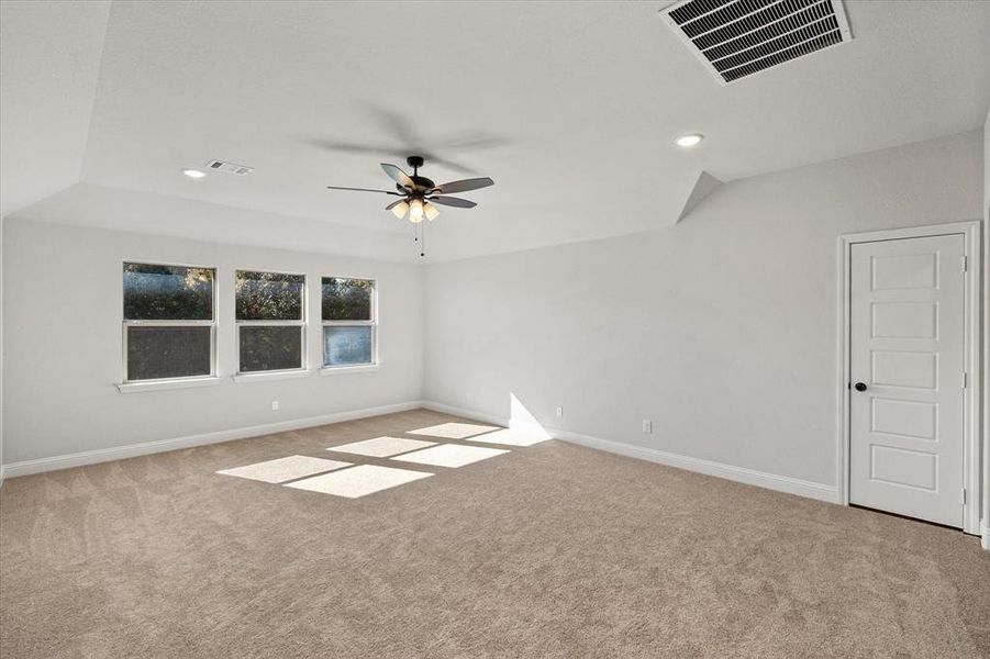 Spare room featuring light colored carpet, recessed lighting, and a ceiling fan Spare room featuring light colored carpet, recessed lighting, and a ceiling fan