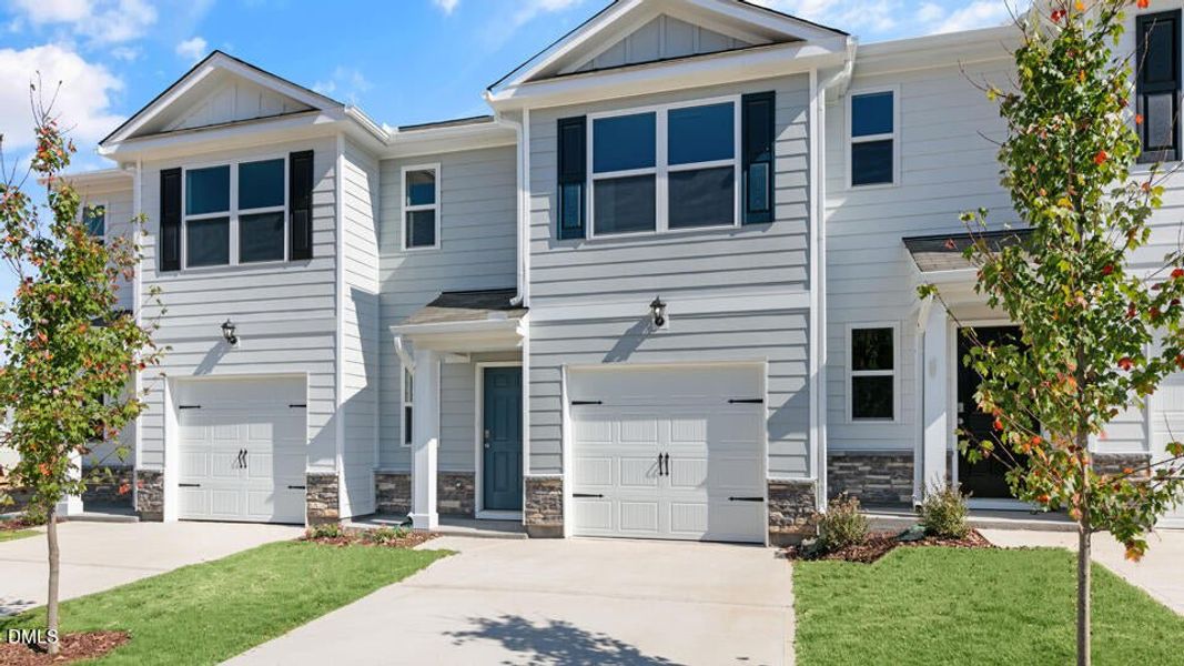 Front exterior of a new home in The Townes at Ridgewood Farms, Winterville, NC, highlighting curb appeal (Image 24).