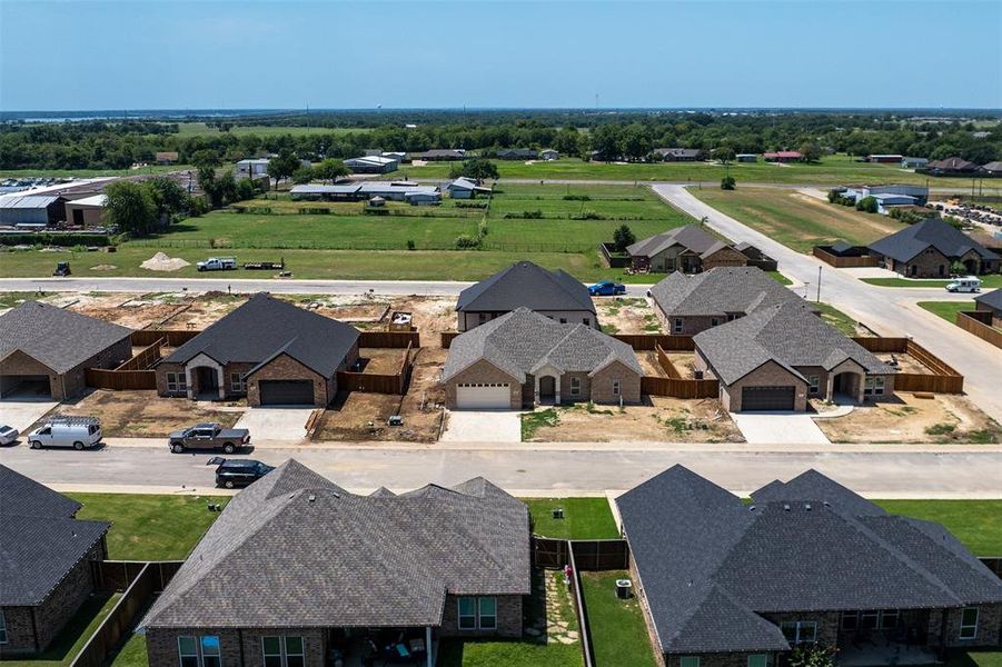 Front exterior of a new home in , Mabank, TX, highlighting curb appeal (Image 19).