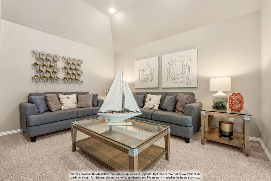 Living room with two gray sofas, glass coffee table, and vaulted ceiling with neutral carpet and wall art Living room with two gray sofas, glass coffee table, and vaulted ceiling with neutral carpet and wall art