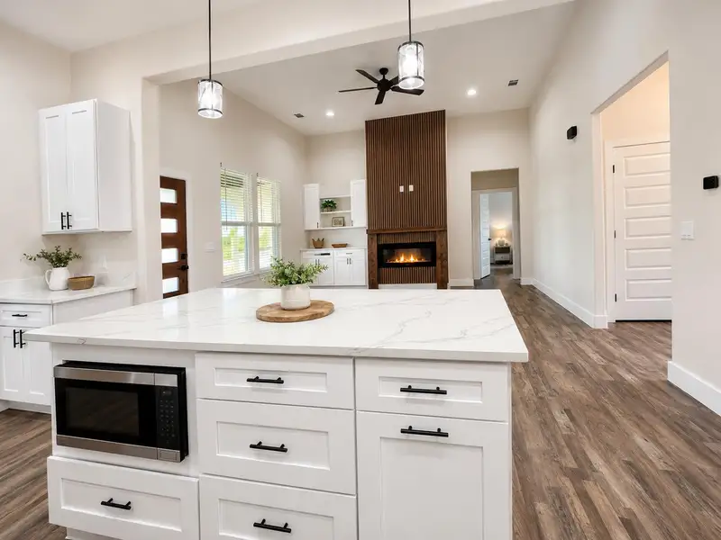 Discover a bright kitchen island featuring a built-in microwave, perfect for entertaining.